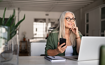 woman sitting at a desk on her laptop