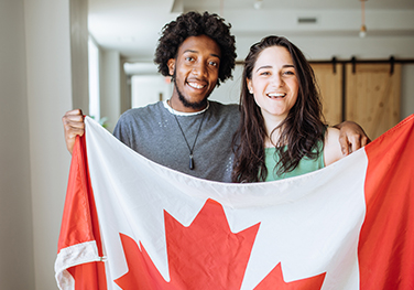 couple holding a canada flag