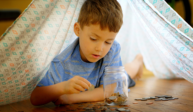 child counting coins