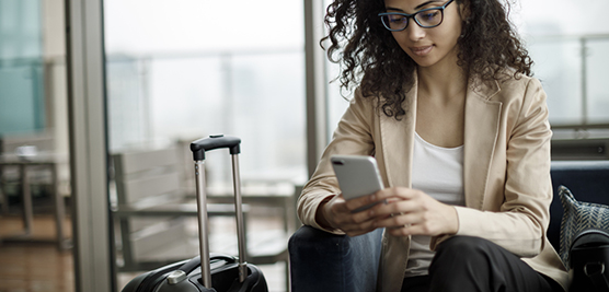 woman on her cell phone at the airport