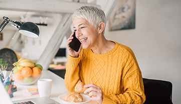 older woman on the phone smiling