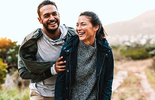 Couple laughing while out going for a walk
